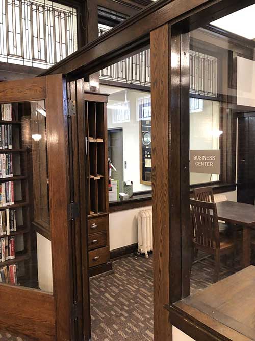Wood Door Paneling and Glass Window Entrance to Business Center