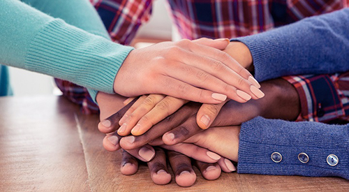 Hands stacked on each other 